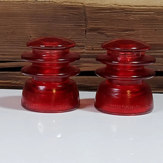 2 Vintage Colorized Red Glass Decorative Antique Insulators.